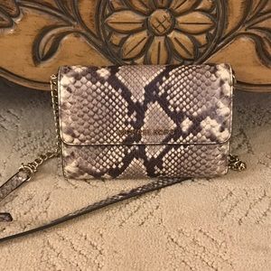 Small Michael Kors clutch with shoulder strap